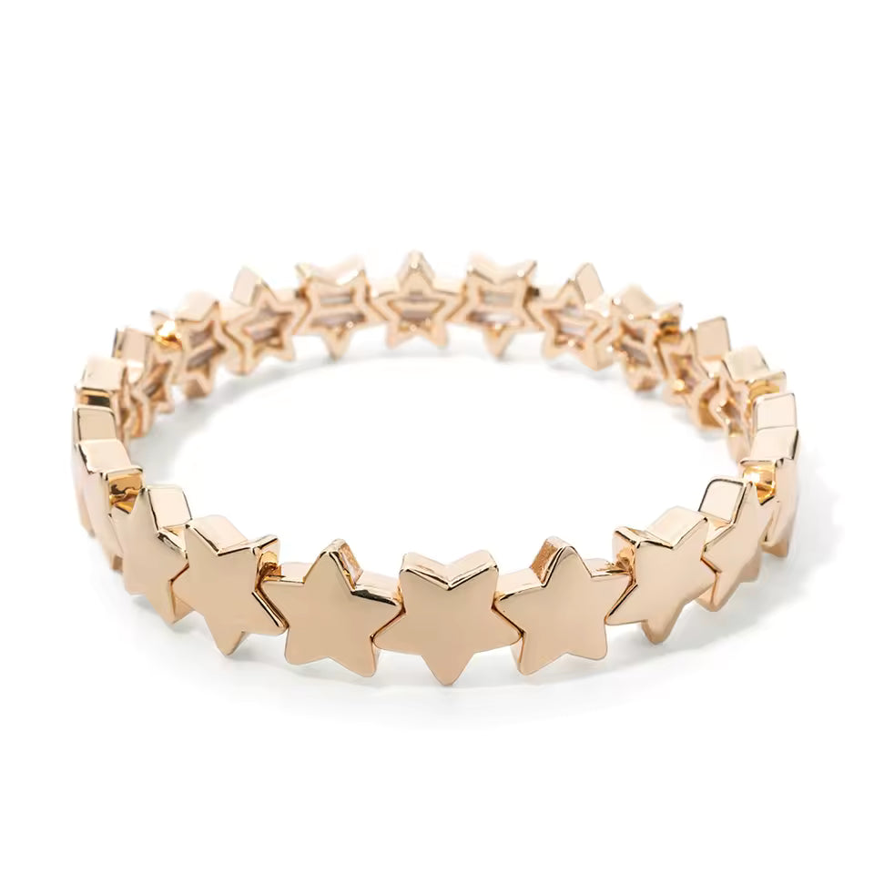 Gold bracelet with star-shaped links on a white background