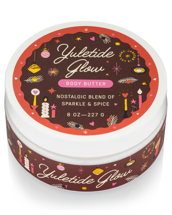Yuletide Glow body butter container with festive design on a white background