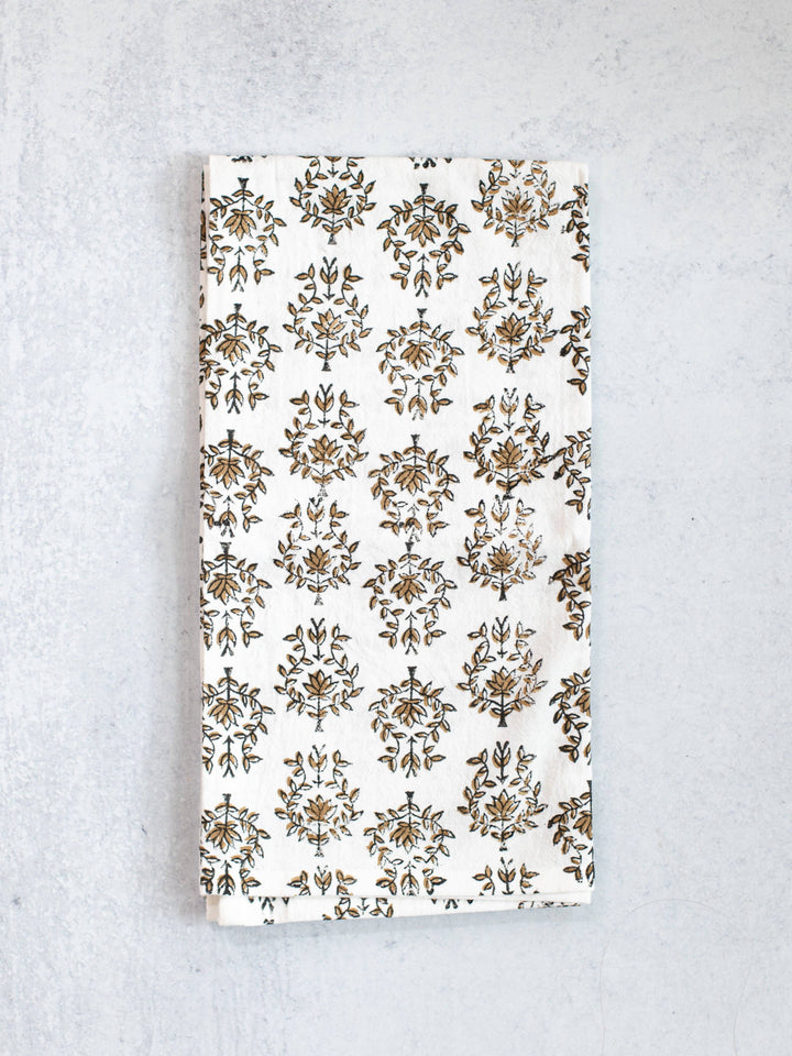 Floral patterned towel on a textured gray background