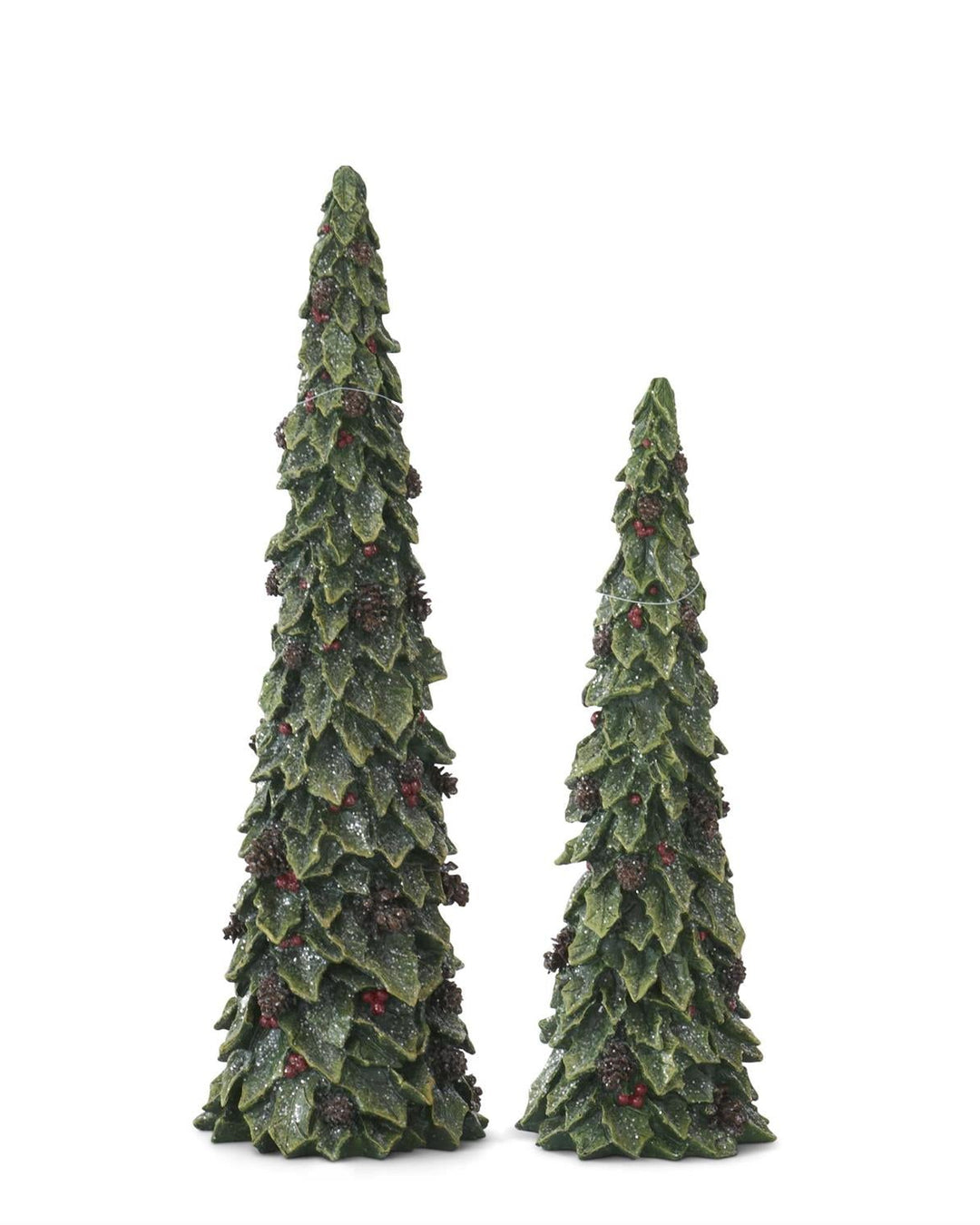 Two artificial Christmas trees with green foliage and red berries on a white background