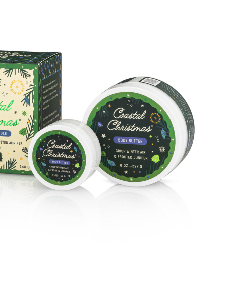 Coastal Christmas bath products including a bar of soap, a jar, and a box on a white background