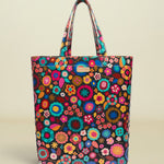 Colorful floral-patterned tote bag on a white background