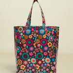 Colorful floral-patterned tote bag on a white background