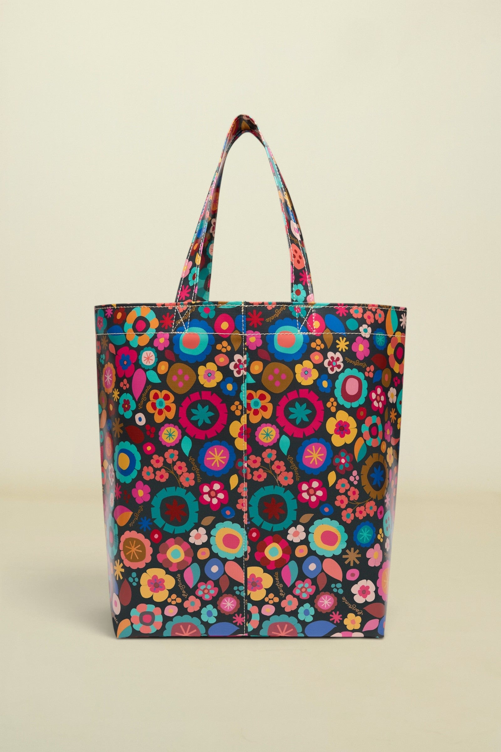 Colorful floral-patterned tote bag on a white background
