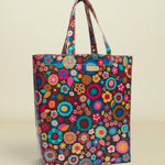 Colorful floral-patterned tote bag on a white background