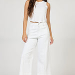 woman wearing white audrey jean and white tank top