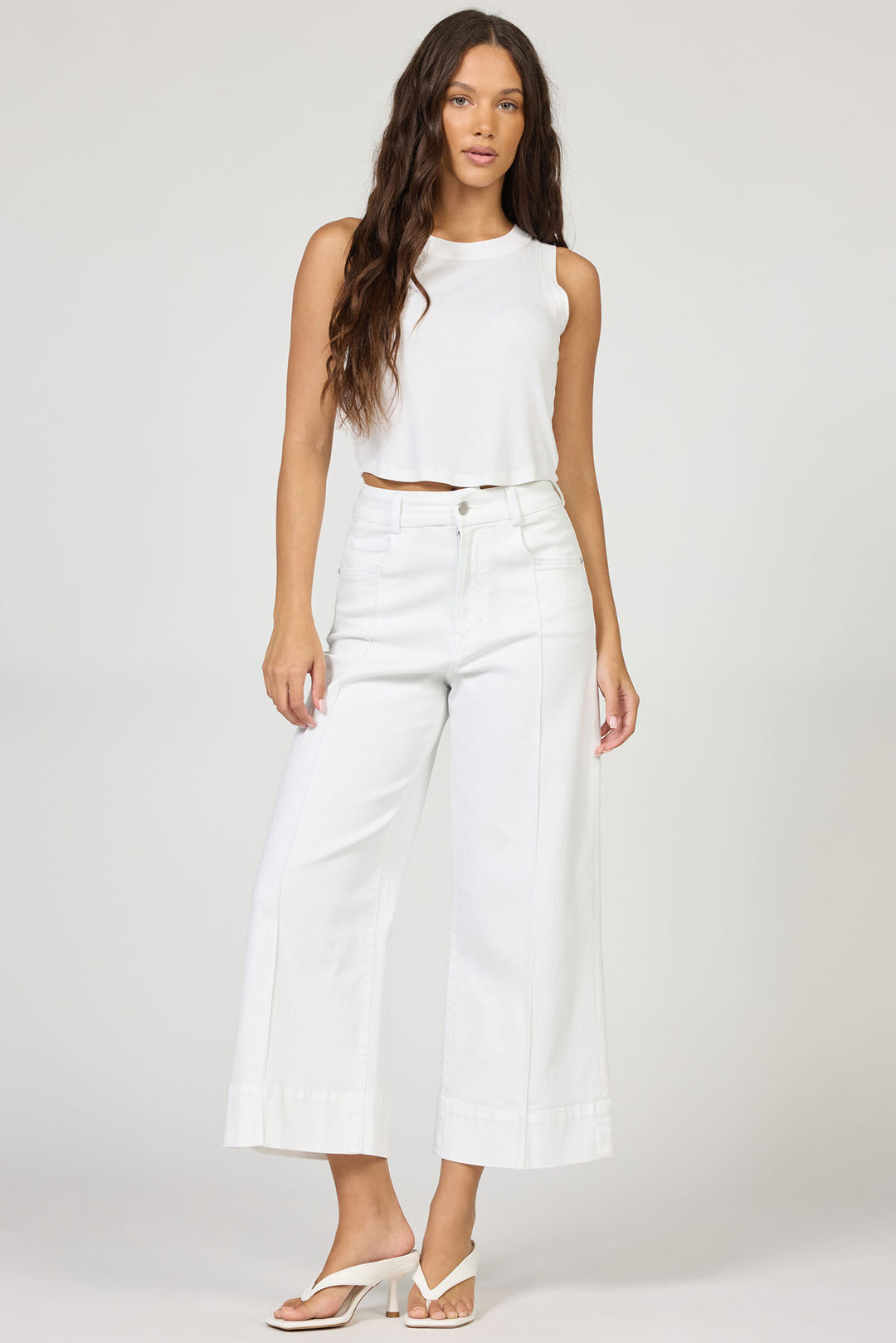 woman wearing white audrey jean and white tank top