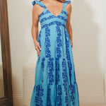 woman wearing blue print maxi dress