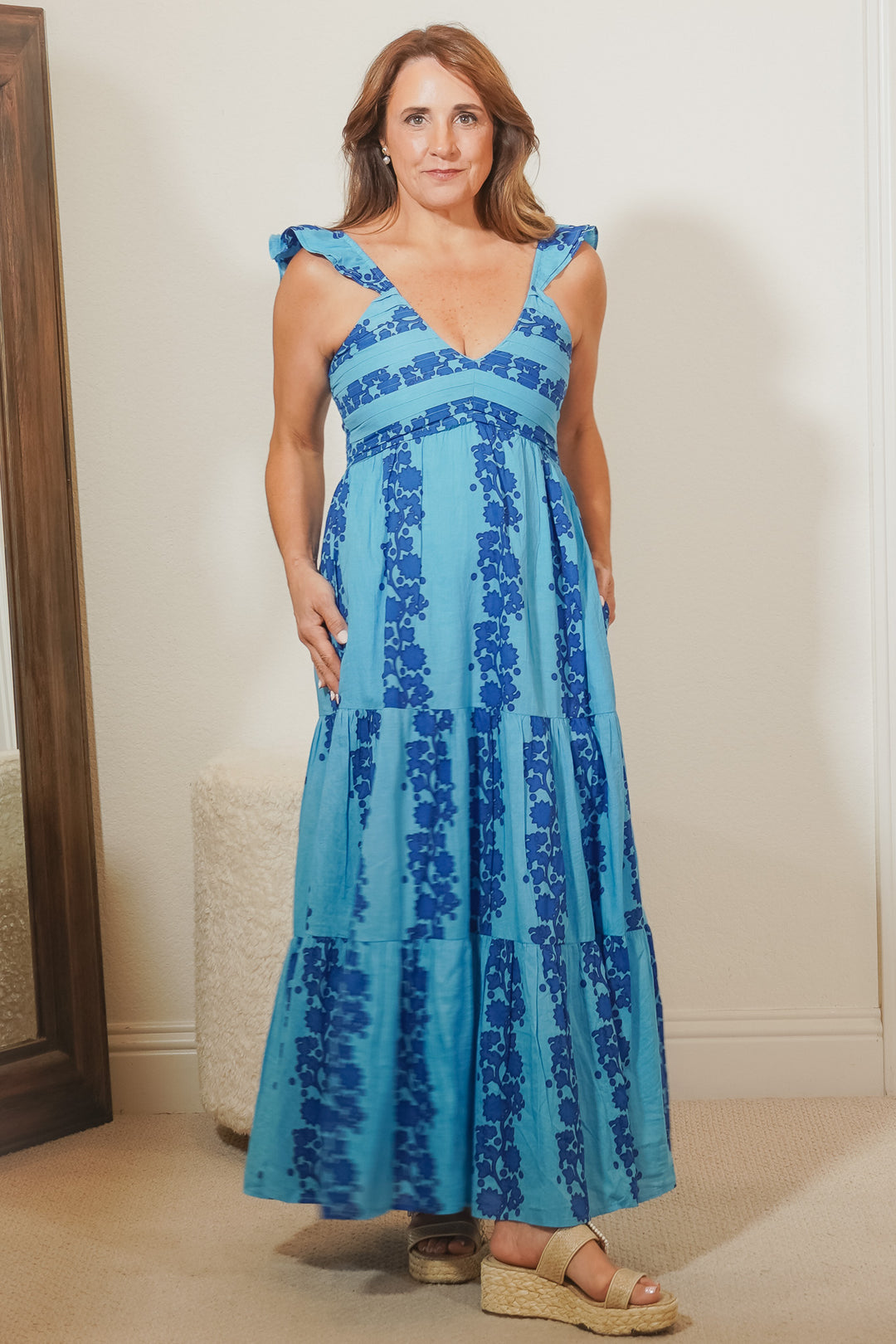 woman wearing blue print maxi dress