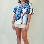 Blue Motif Print Puff Sleeve Top with tan shorts
