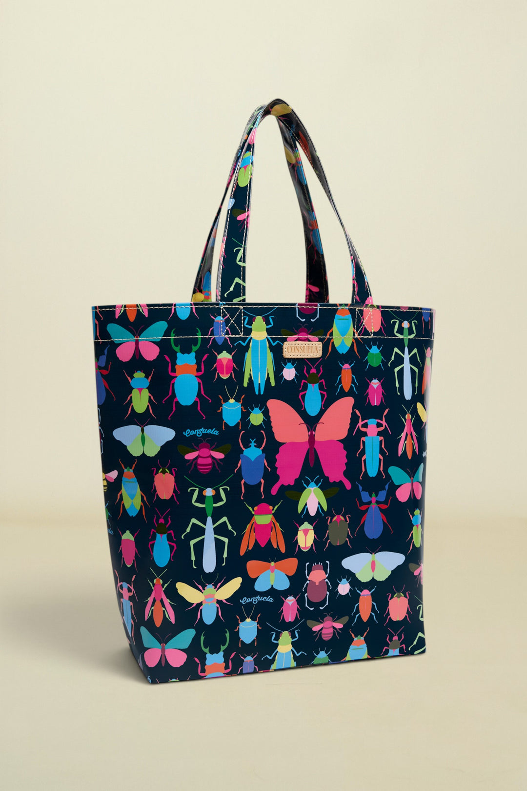 Tote bag with colorful insect pattern on a white background