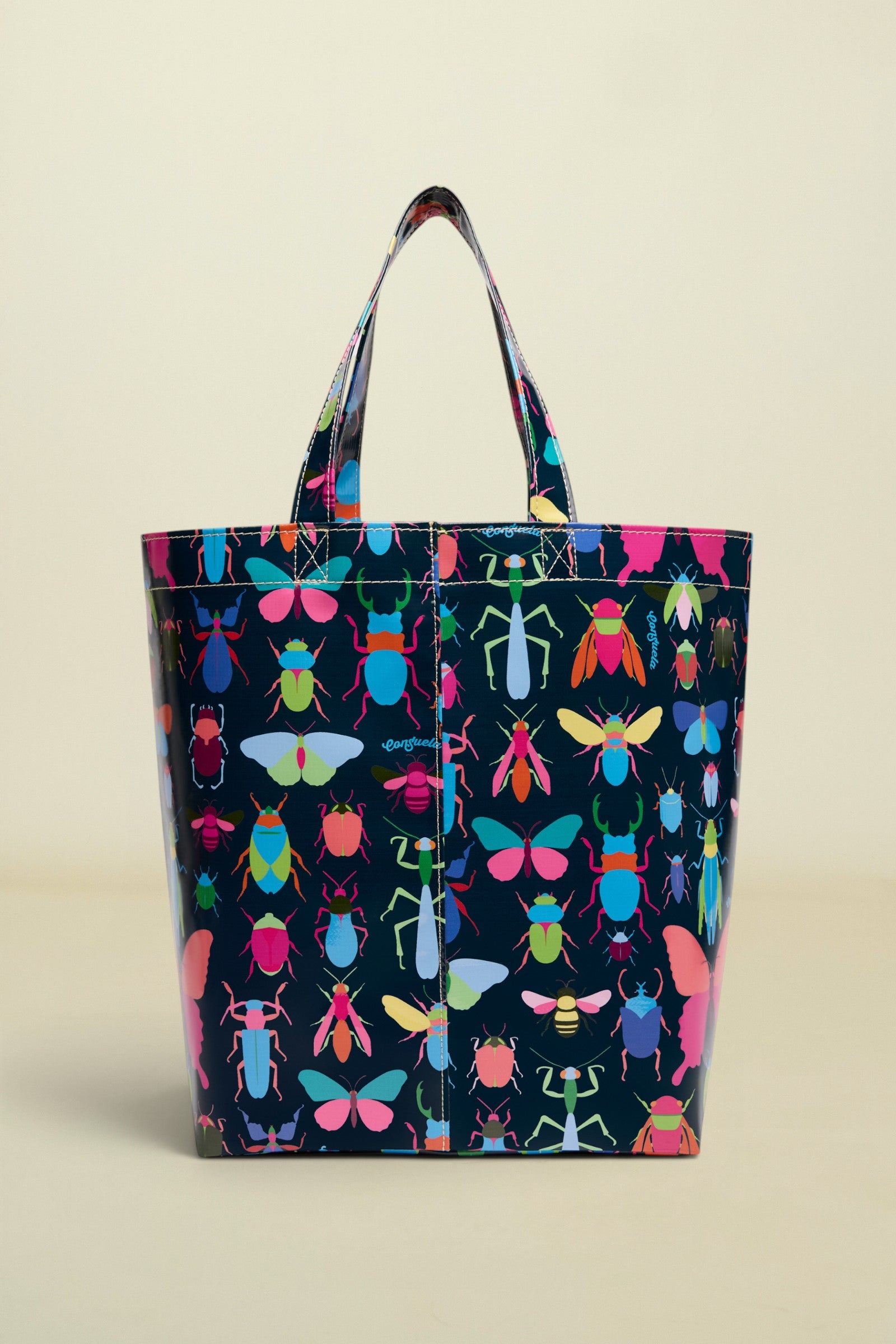 Tote bag with colorful insect pattern on a white background