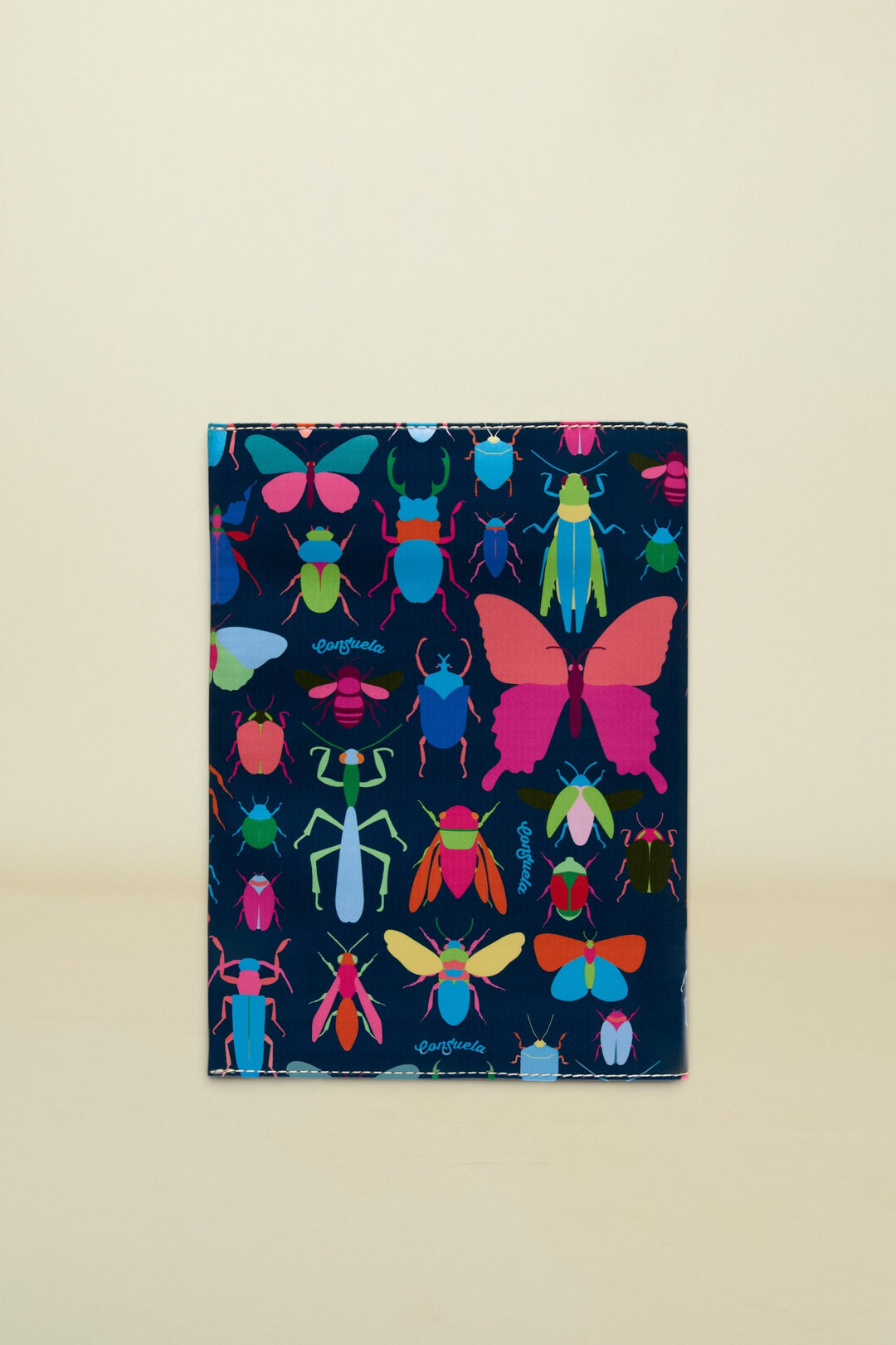 Consuela Gemma Notebook with a dark blue cover and a colorful insect pattern