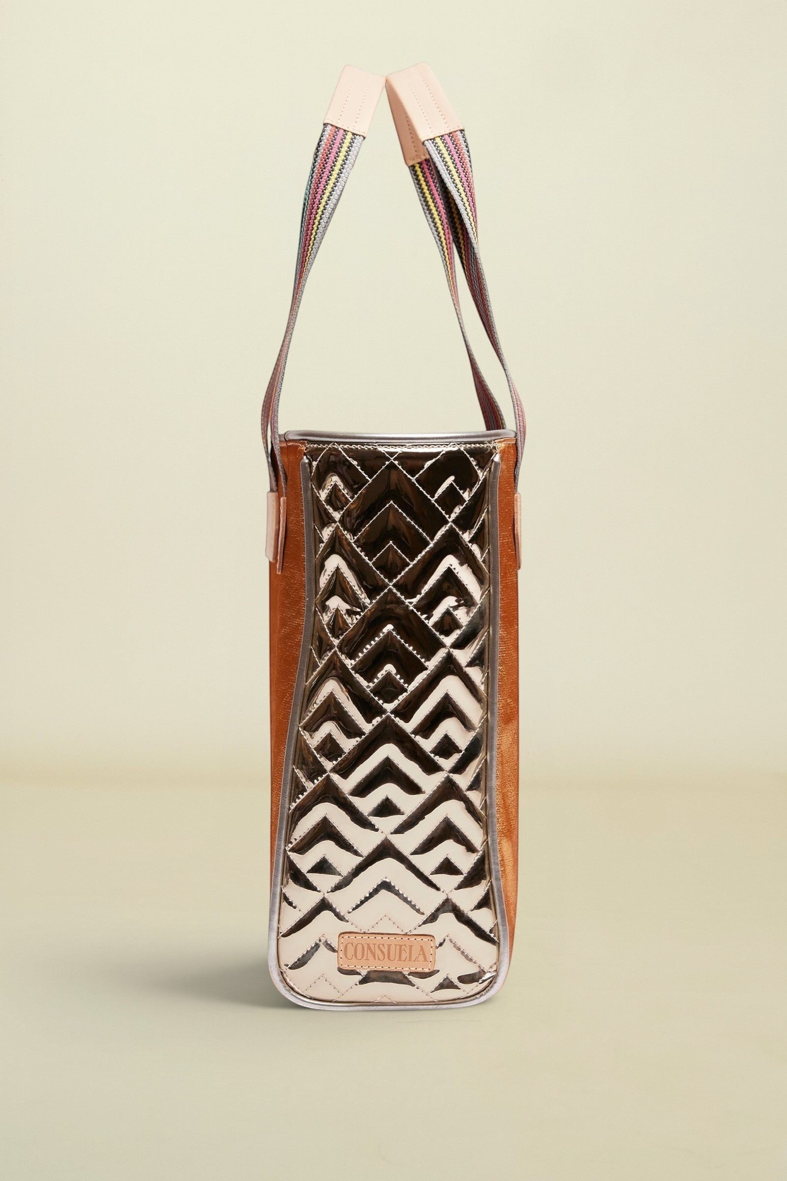 Handbag with geometric pattern on a beige background