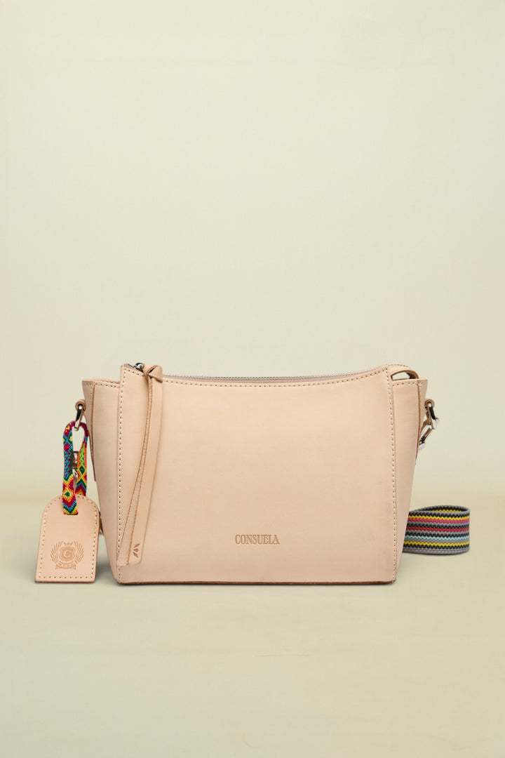 Beige handbag with a colorful strap and tag on a white background