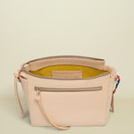 Beige handbag with a zipper on a white background