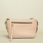 Beige handbag with a strap on a white background