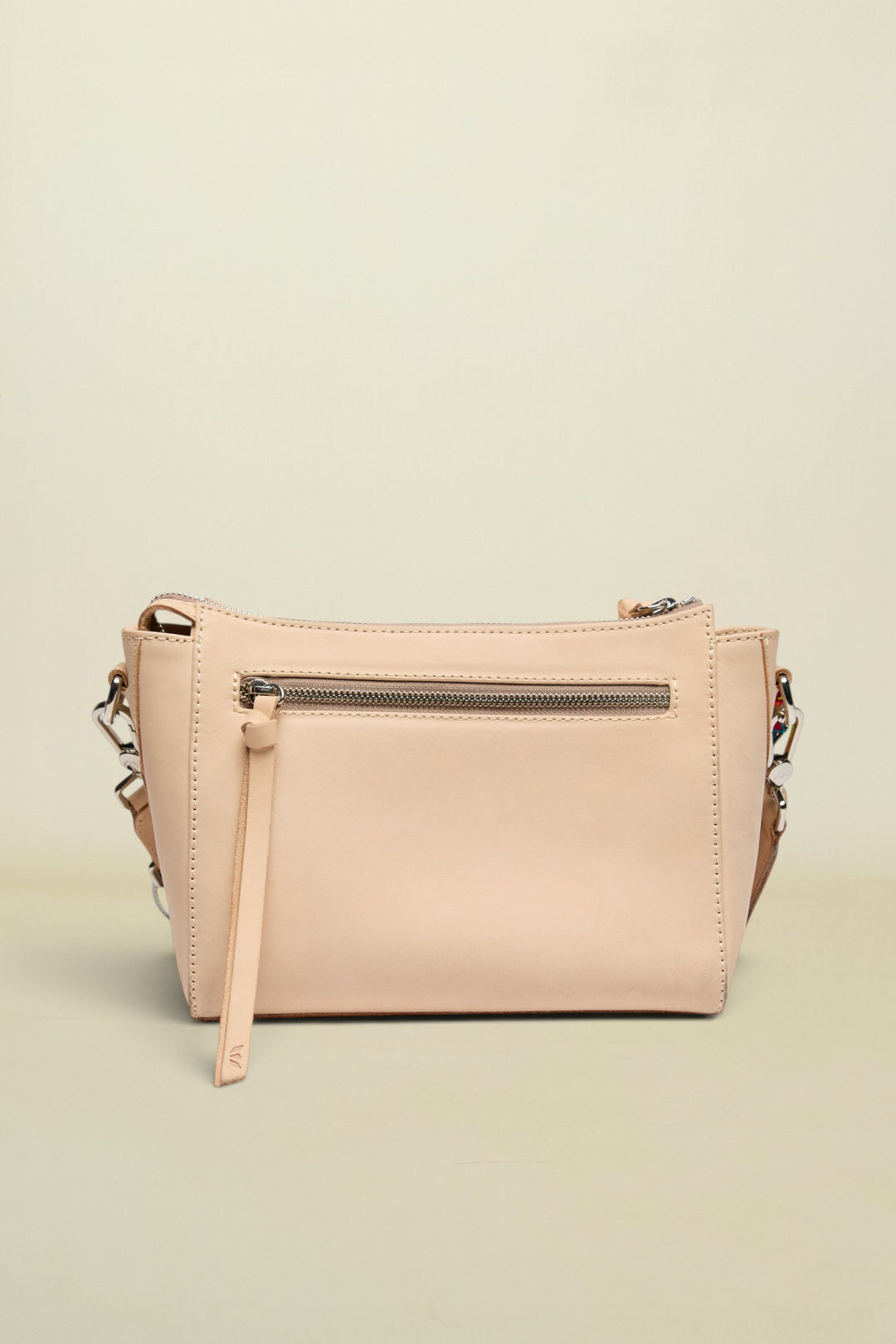 Beige handbag with a strap on a white background