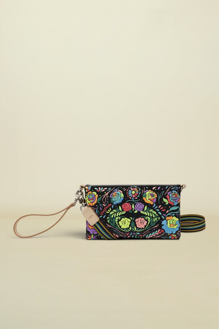 Consuela Rita Uptown Crossbody front view of black vinly with neon embroidered flowers