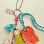 Colorful keychain with various charms on a white background