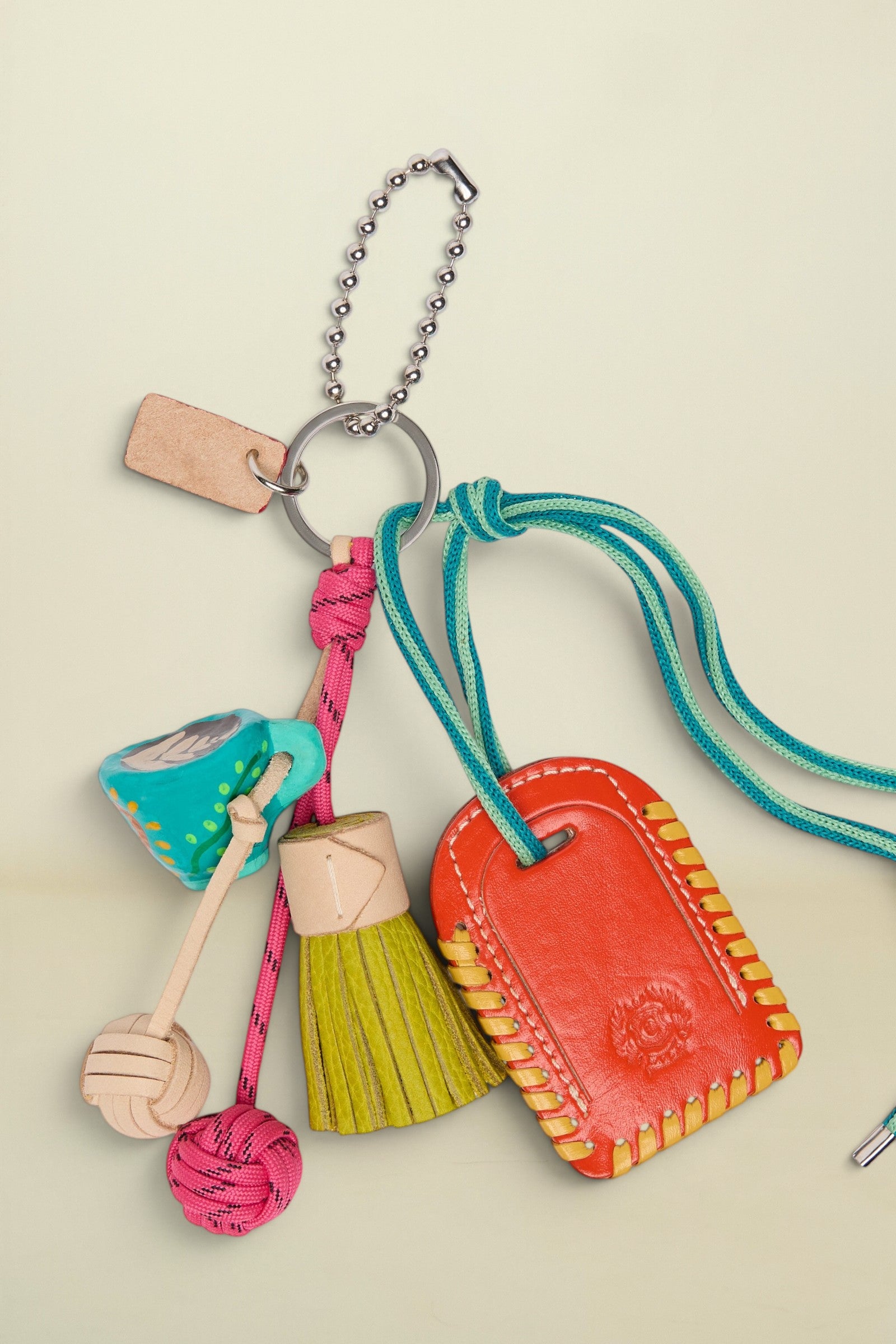 Colorful keychain with various charms on a white background