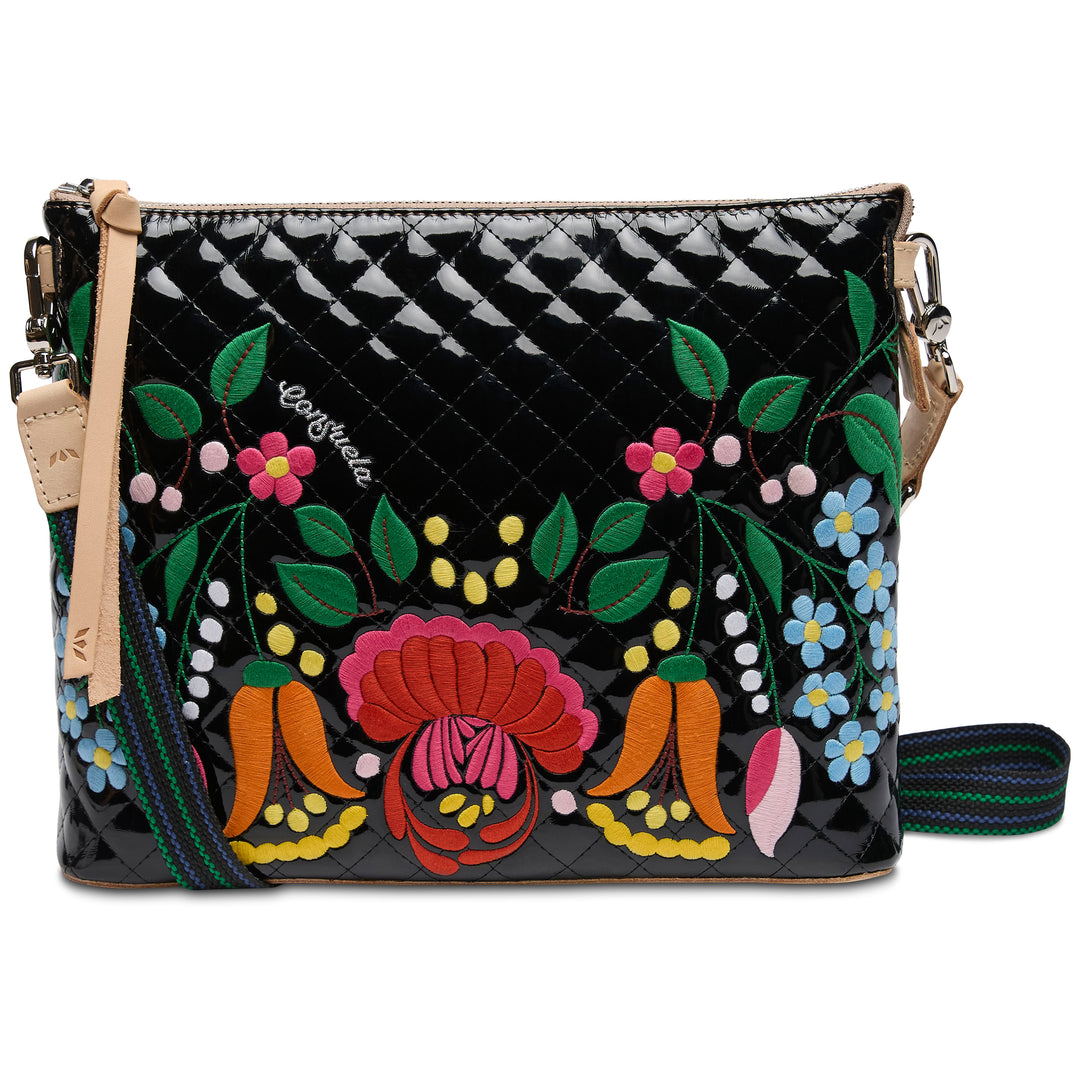 Floral embroidered handbag with a black and white checkered pattern on a white background