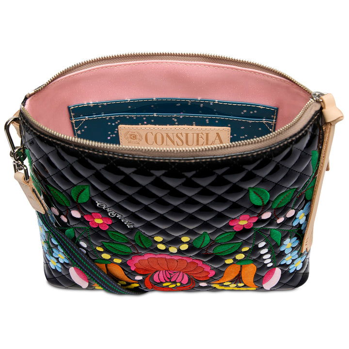 Black quilted handbag with colorful floral embroidery on a white background