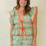 Dalila Tropical Print Peplum Top with Front Ties on model with matching shorts