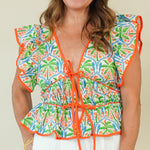 Dalila Tropical Print Peplum Top with Front Ties on model with white shorts
