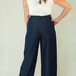 Woman wearing navy wide leg drawstring pants back view