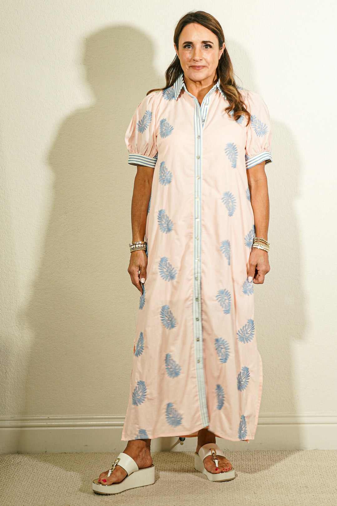 Women's Entro blush pink botanical block print maxi shirtdress with blue leaf motif, puff sleeves, and button-front striped placket on model