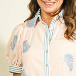 Entro botanical block print button-front maxi dress in blush pink with periwinkle blue leaf print and contrast striped collar and cuffs on model