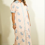 Entro botanical block print button-front maxi dress in blush pink with periwinkle blue leaf print and contrast striped collar and cuffs on model