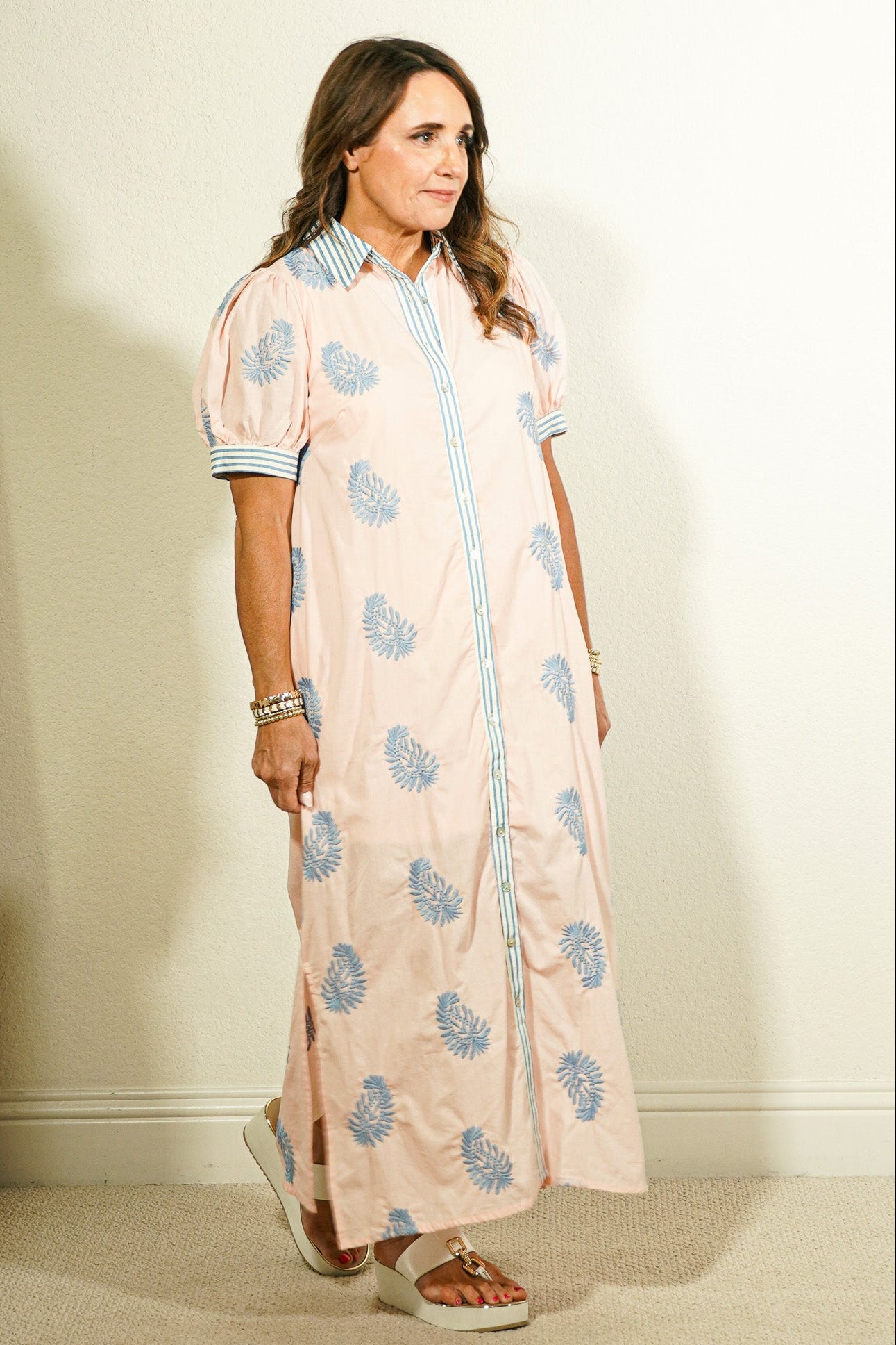 Entro botanical block print button-front maxi dress in blush pink with periwinkle blue leaf print and contrast striped collar and cuffs on model