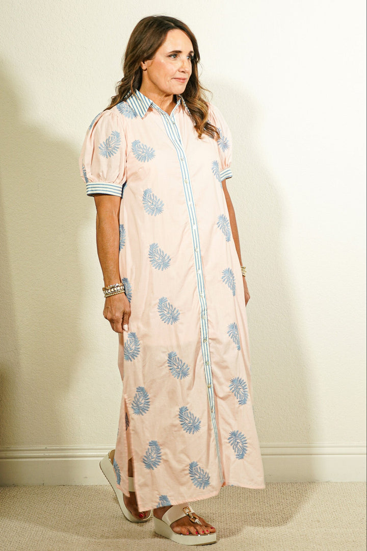 Entro botanical block print button-front maxi dress in blush pink with periwinkle blue leaf print and contrast striped collar and cuffs on model