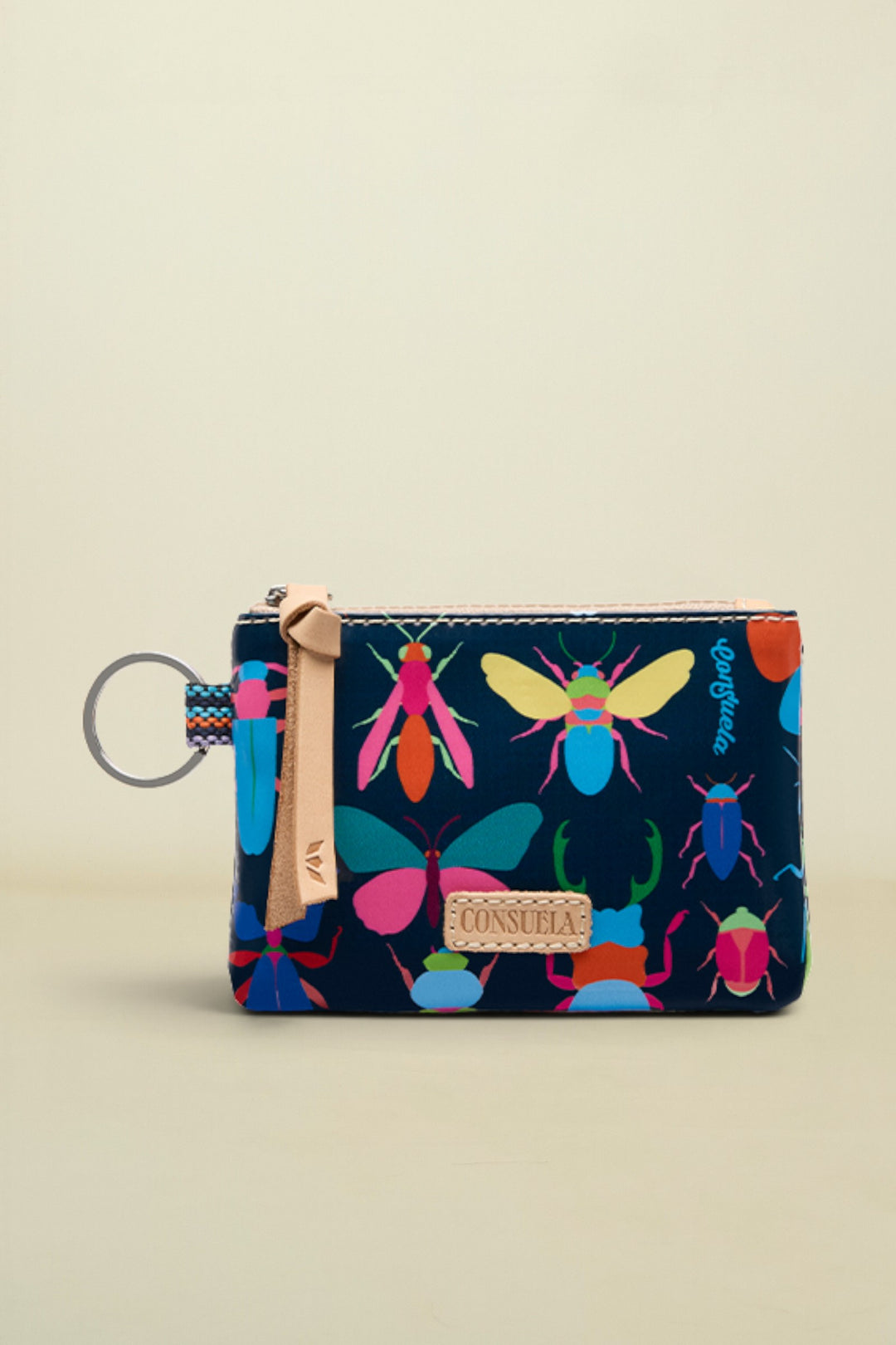 Small pouch with colorful insect design on a beige background