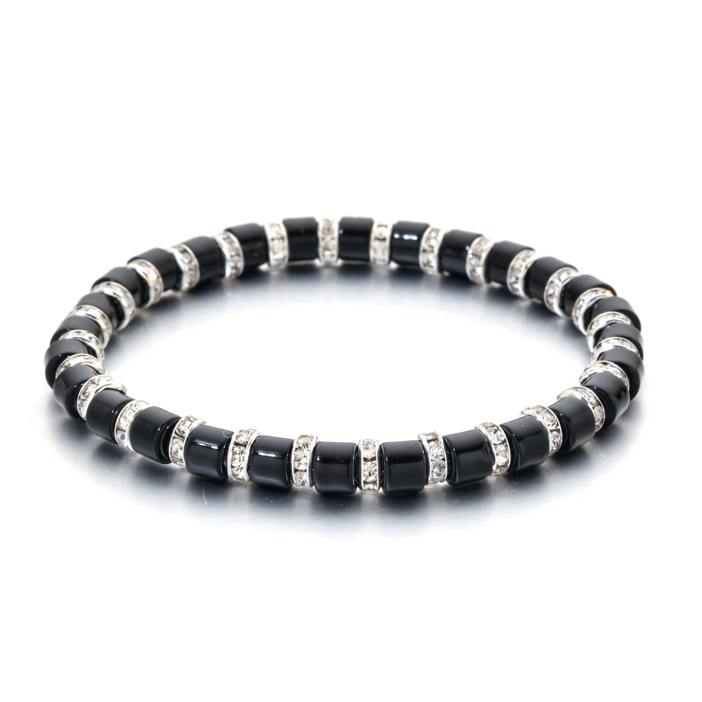 Black beaded bracelet with silver accents on a white background