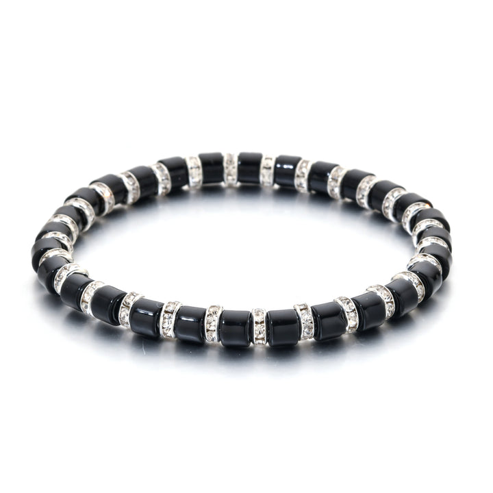 Black beaded bracelet with silver accents on a white background