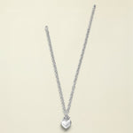 Silver necklace with a heart pendant on a white background