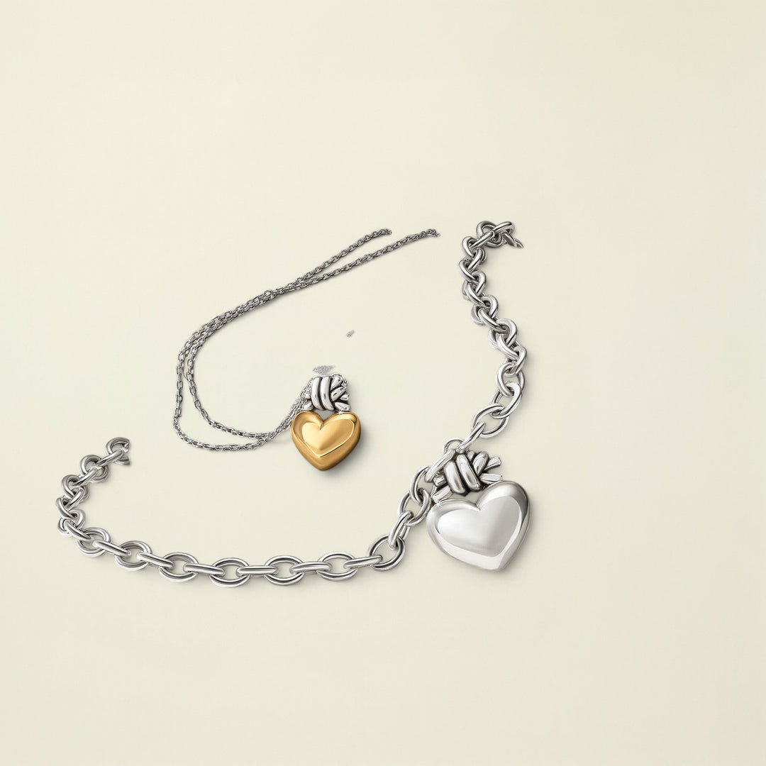 Bracelet with heart-shaped charms on a stone surface