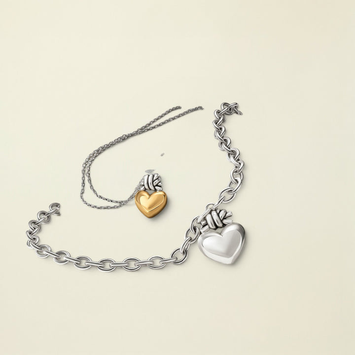 Bracelet with heart-shaped charms on a stone surface