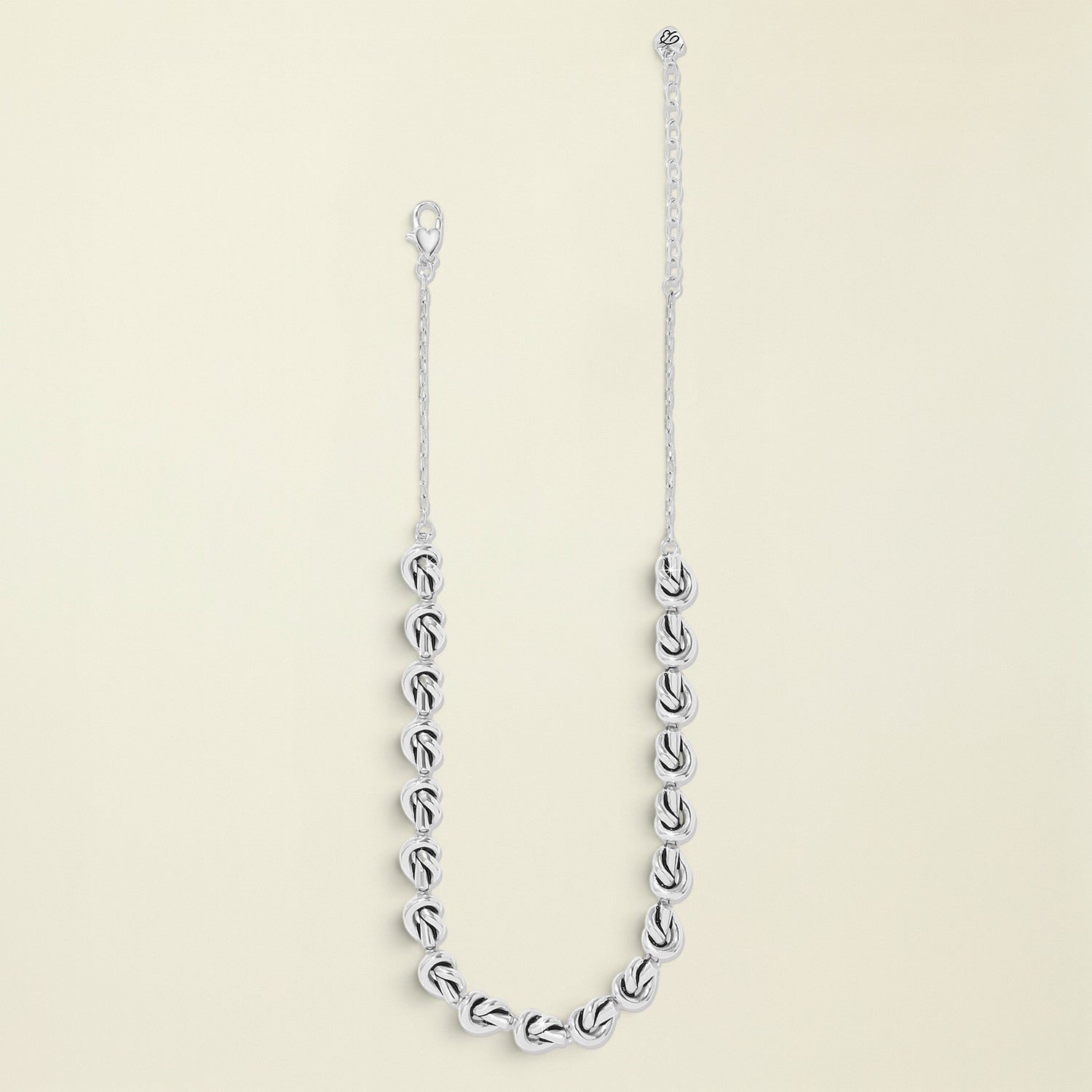 Silver chain necklace on a white background