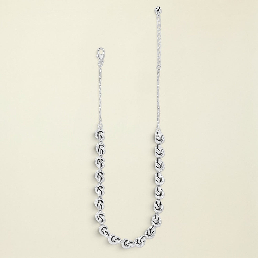 Silver chain necklace on a white background