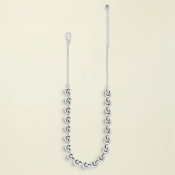 Silver chain necklace on a white background