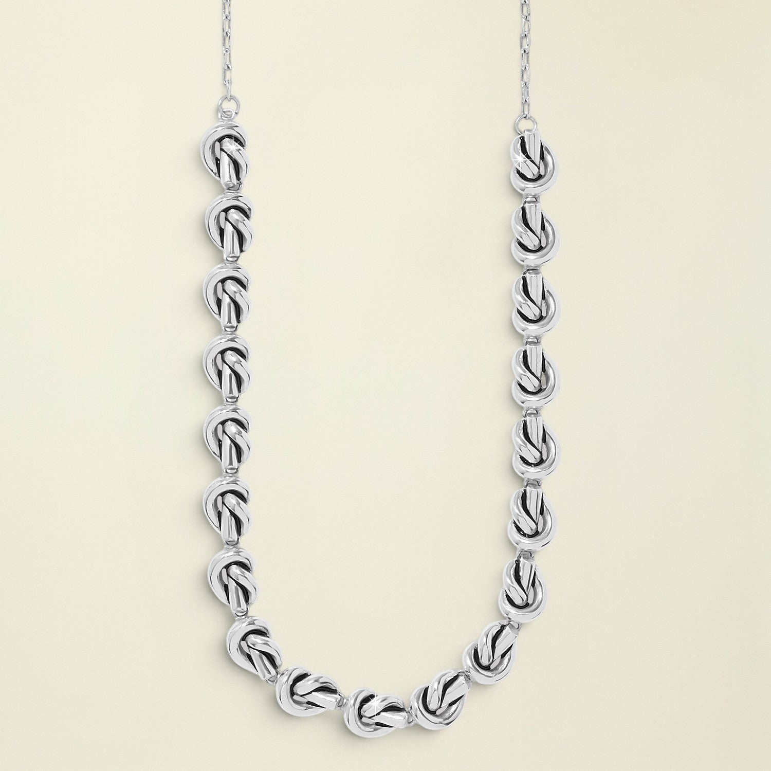 Silver chain necklace on a white background