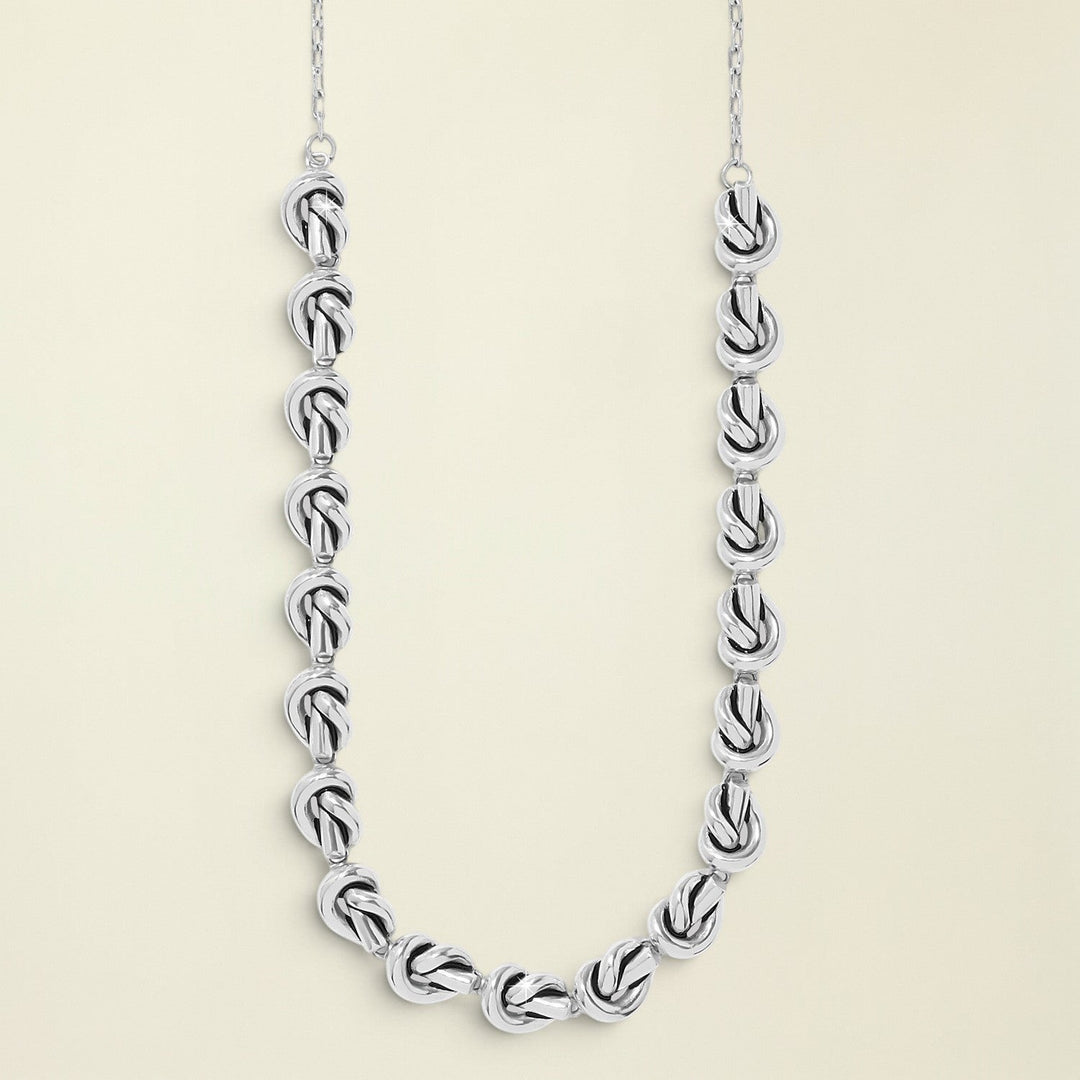 Silver chain necklace on a white background