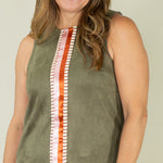 Woman wearing olive suede racing stripe dress with tan wedges