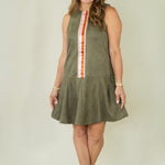 Woman wearing olive suede racing stripe dress with tan wedges