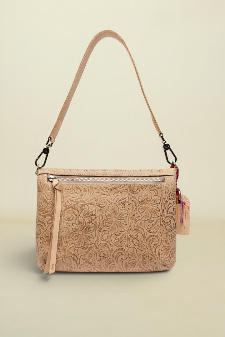 Beige floral-patterned handbag with a strap on a white background