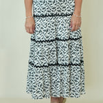 Lucia Leaf Print Tiered Skirt on woman with a black top 